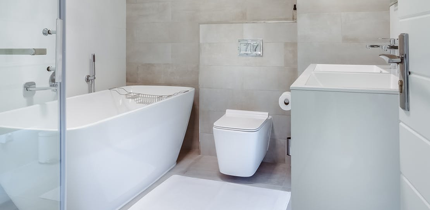 A beautiful white color bathroom with a bathtub